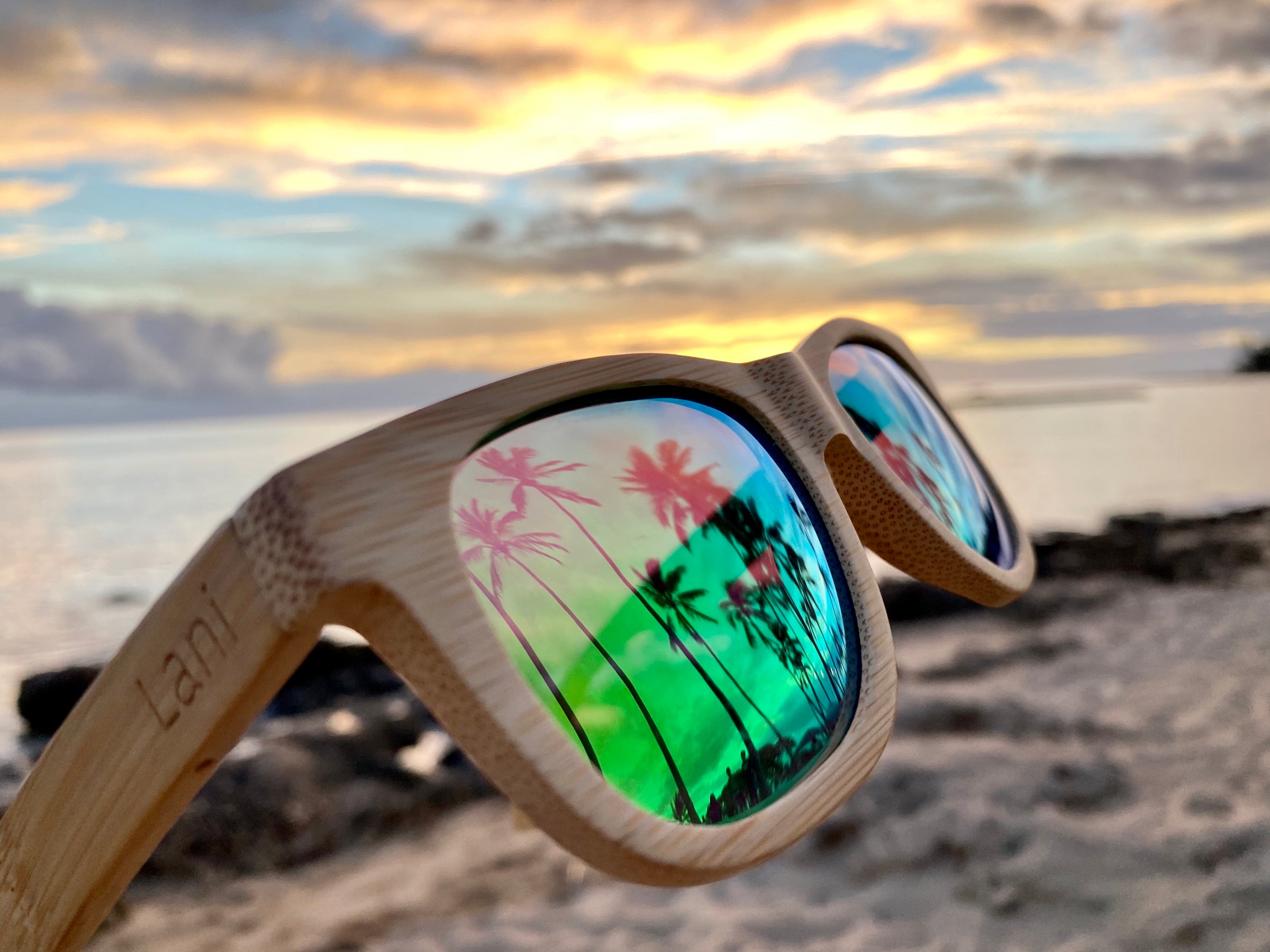 Lani Shades best polarized lenses in bamboo floating sunglasses frames at the beach in Hawaii